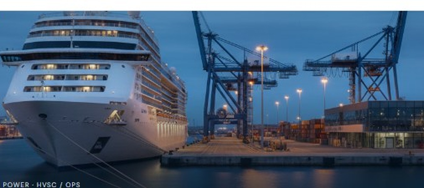 Cruise vessel alongside port infrastructure at dusk